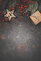 Christmas concept background.Christmas tree branches with christmas star and christmas gift photo