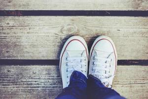 sneakers on wooden floor photo