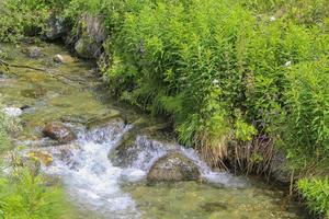 Flowing river Lake Hemsila in Hemsedal, Viken, Buskerud, Norway. photo