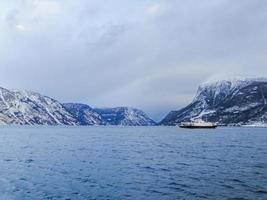 Ferry boat in Laerdal, Vestland, Norway. Winter fjord landscape. photo