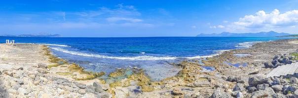 Coast sculptures and beach landscape panorama Can Picafort Mallorca Spain. photo