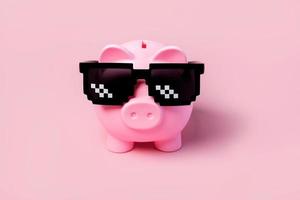 Pink piggy money bank with black sunglasses photo