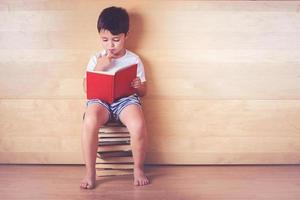 boy reading a book photo