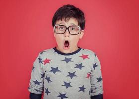 surprised boy with glasses photo