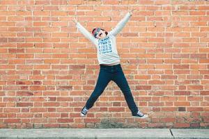 happy child jumping on the street photo