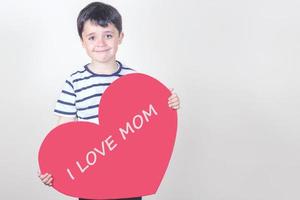 I love mom, happy child with a red heart photo