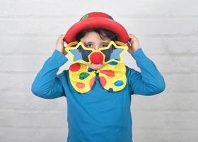 child with clown nose and funny glasses photo