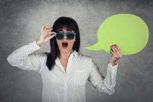 Young Woman holding a speech bubble photo