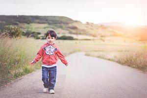 child on the road photo