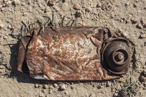 rusty insecticide canister photo