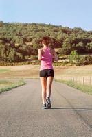 Girl running on the road photo