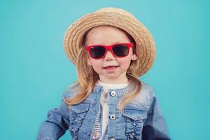 baby with hat and sunglasses photo