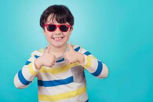 smiling boy with sunglasses photo