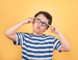 Portrait of thoughtful child with eyeglasses photo