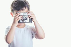 smiling boy with photo camera