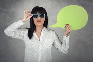 Young Woman holding a speech bubble photo