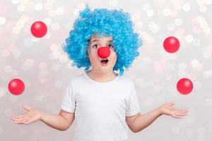 Funny child in carnival on white background photo