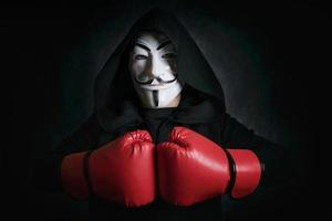 man with Masking anonymous and boxing gloves photo