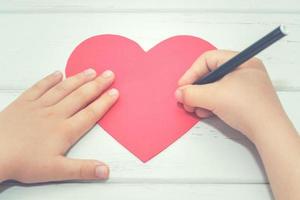 hands of a boy with a heart photo