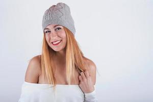 smiling Young woman  with winter hat photo