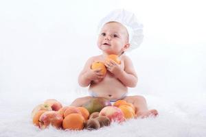 Funny baby with fruits photo