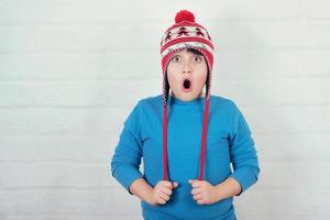 funny child with winter hat photo