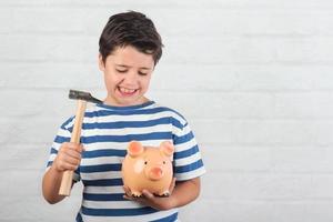 funny child with piggy bank photo