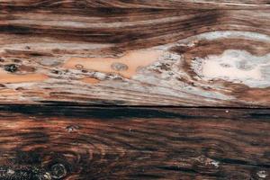 Wood texture background, weathered brown plank from barn photo