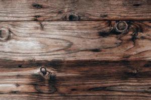 Wood texture background, weathered brown plank from barn photo