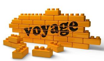 voyage word on yellow brick wall photo