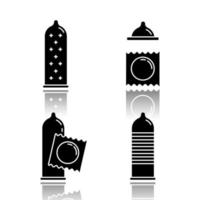 Condom drop shadow black glyph icons set. Safe sex. Female latex reusable contraceptive with dots in package. Preservative method. Pregnancy prevention, STI precaution. Isolated vector illustrations