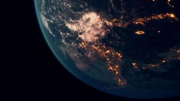Earth planet viewed from space at night showing the lights of countries video