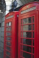 Two red phone booths in London. photo