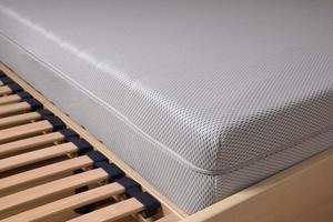 cold foam mattress on slatted frame photo