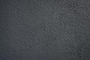 black wall roughcast plaster background texture photo