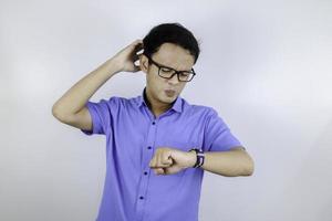 Being late to work and deadline, Young asian man is time delay and late on project. Executive angry, hurry, stress, frustrated and unsatisfied worker man lateness to office. photo