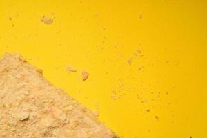 Napoleon cake on a yellow background. Filmed from above. Place for a logo. photo