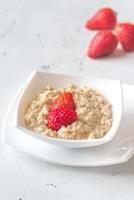 Bowl of oats with fresh strawberries