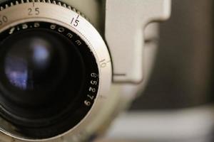 Vintage old photography film camera with lens. Close up macro shot photo