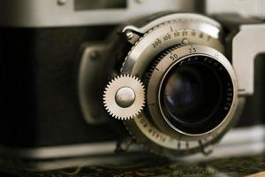 Vintage old photography film camera with lens. Close up macro shot photo