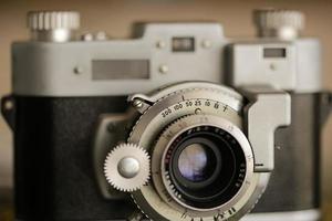 Vintage old photography film camera with lens. Close up macro shot photo