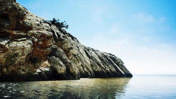 beautiful rocky cliff in the middle of the sea video