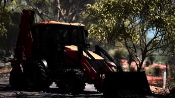 excavator tractor in bush forest video