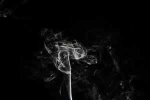 Smoke effect texture. Isolated background. Black and dark backdrop. Smokey fire and mistic effect. photo