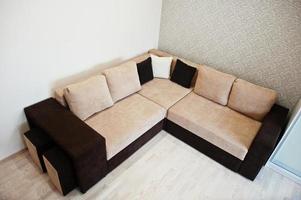 Bicolor cofee corner sofa bed at light room photo