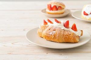 strawberry fresh cream croissant on plate photo