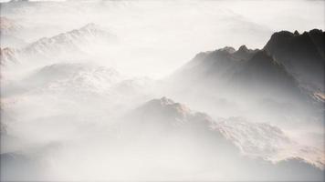 Distant mountain range and thin layer of fog on the valleys video