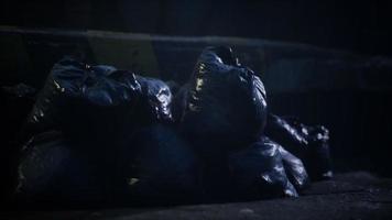 Garbage bags at city street an night video