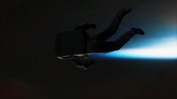 astronauta flutuando acima da terra