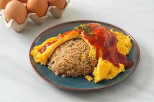 Flavored Fried Rice in an Omelet Wrapping photo